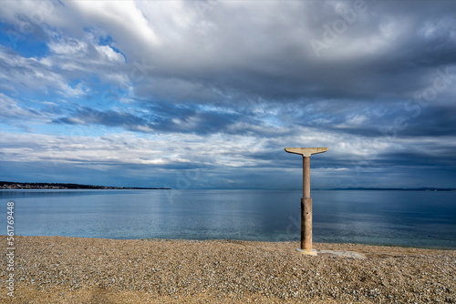 Shower on the pebble beach after the end of the season