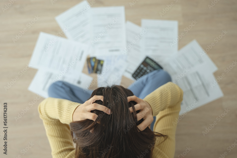 stressed young asian woman trying to find money to pay credit card debt. - obrazy, fototapety, plakaty 