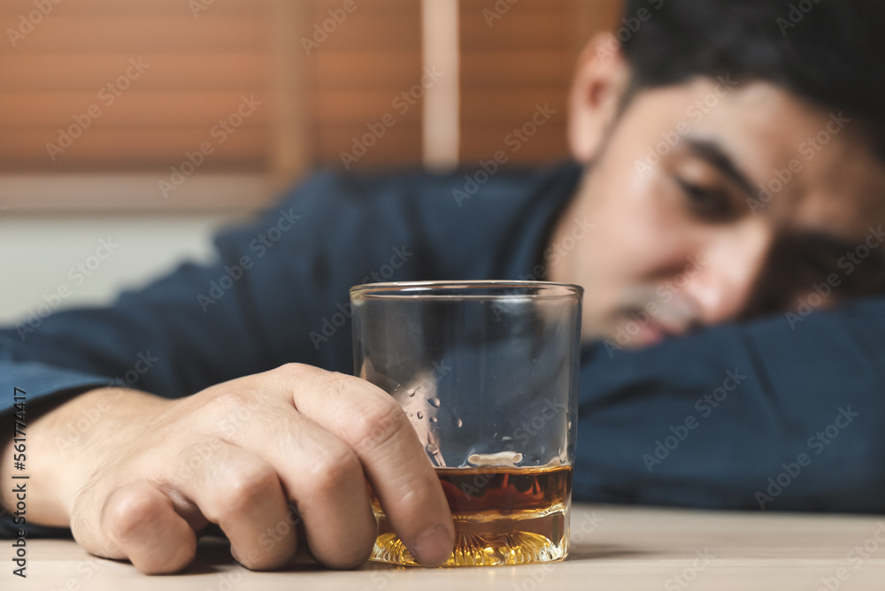drunk man fall asleep on the table with whiskey glass drunk man fall asleep on the table with whiskey glass