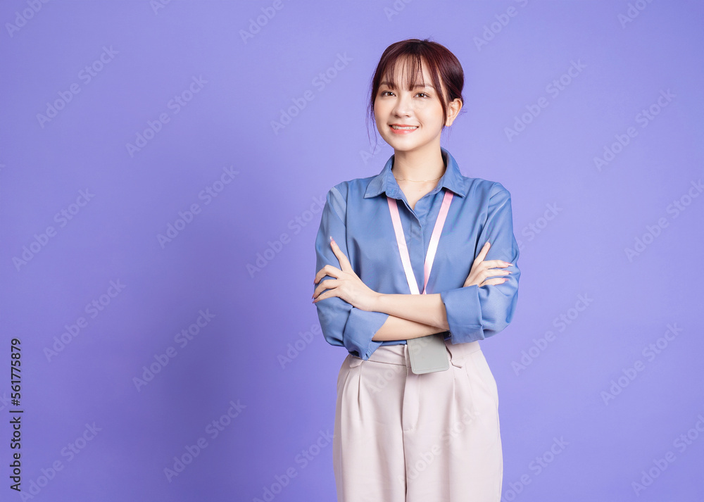 Image of young Asian business woman on purple background Image of young Asian business woman on purple background