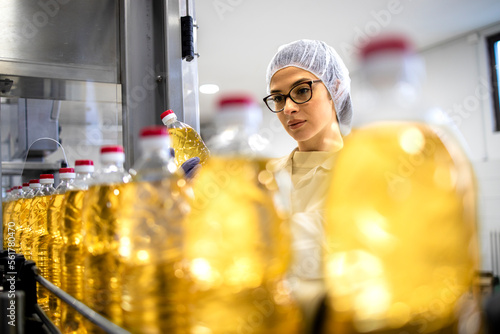 Technologist doing quality control in food factory. photo