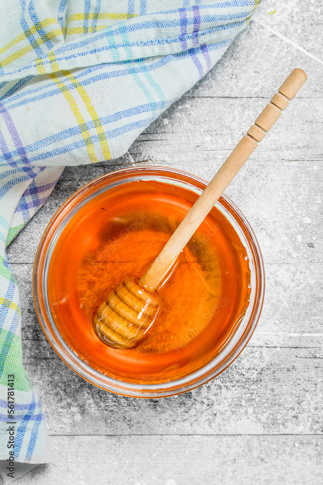 Natural honey in jar with wooden spoon. Natural honey in jar with wooden spoon.