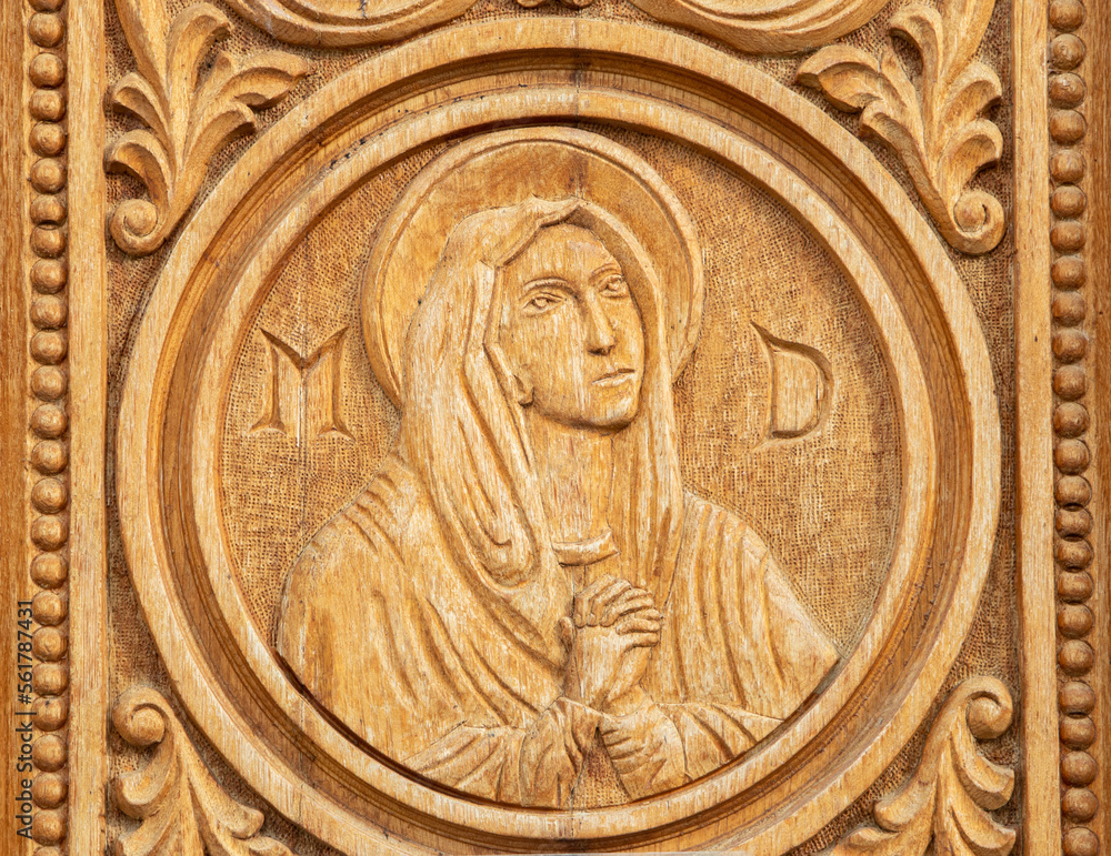 A close-up of a wooden engraving representing the face of the Mother of God at the Dumbrava monastery - Romania