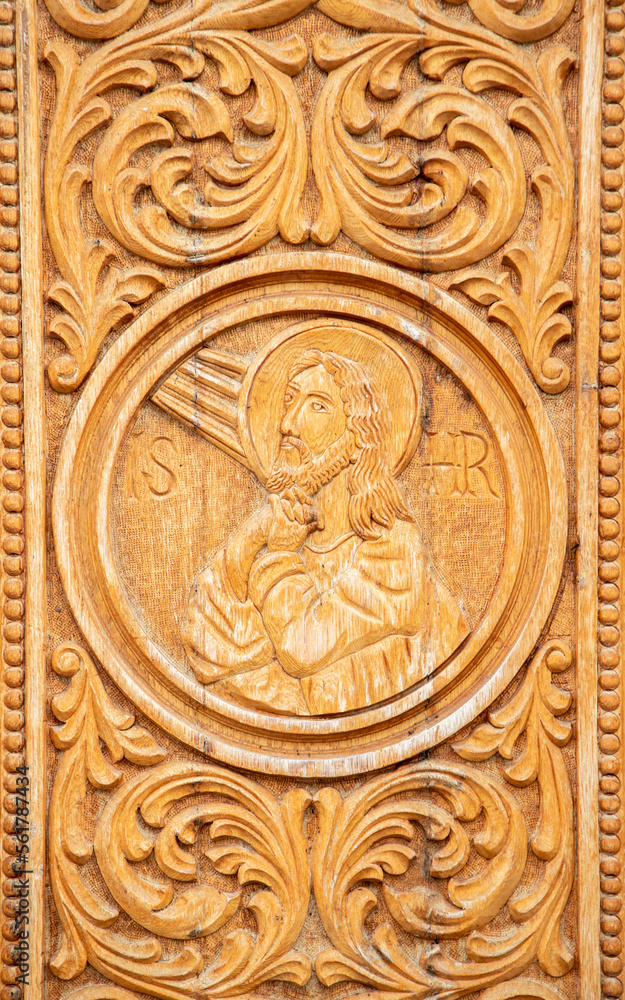 A close-up of a wood engraving representing the face of Jesus Christ at the Dumbrava monastery - Romania