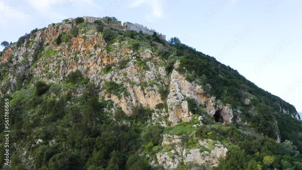 Drone view of Nestor’s Cave and Old Navarino Castle on the mountaintop Drone view of Nestor’s Cave and Old Navarino Castle on the mountaintop