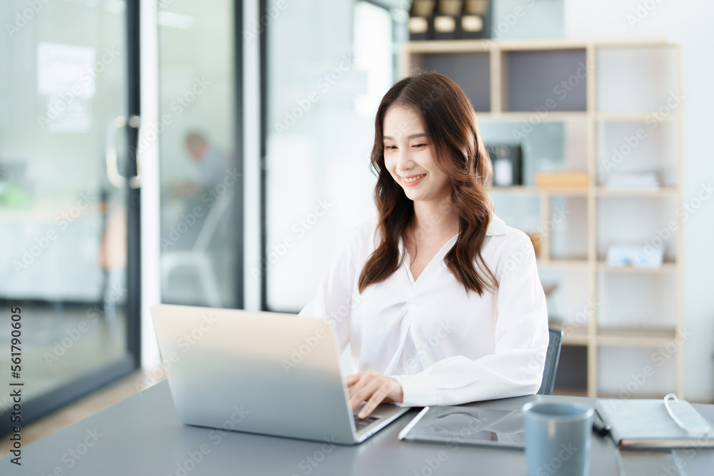 business owner or Asian female marketers are using tablet computer in office work business owner or Asian female marketers are using tablet computer in office work