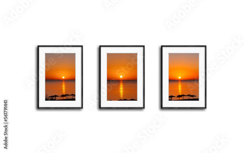 Three black frames set with pictures of colorful sunrise over the sea isolated on white wall, 3D illustration