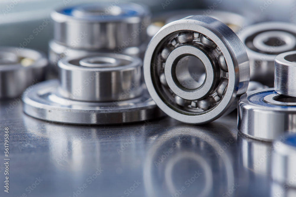 different bearings on a metal background. Part of mechanism. different bearings on a metal background. Part of mechanism.