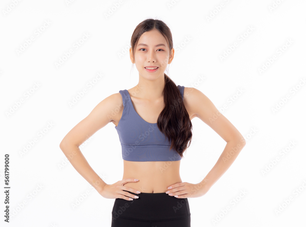 Portrait of beautiful young asian woman in sportwear smile and showing waist and abs isolated on white background, sport and exercise for health, female slimming with confident and wellness Portrait of beautiful young asian woman in sportwear smile and showing waist and abs isolated on white background, sport and exercise for health, female slimming with confident and wellness