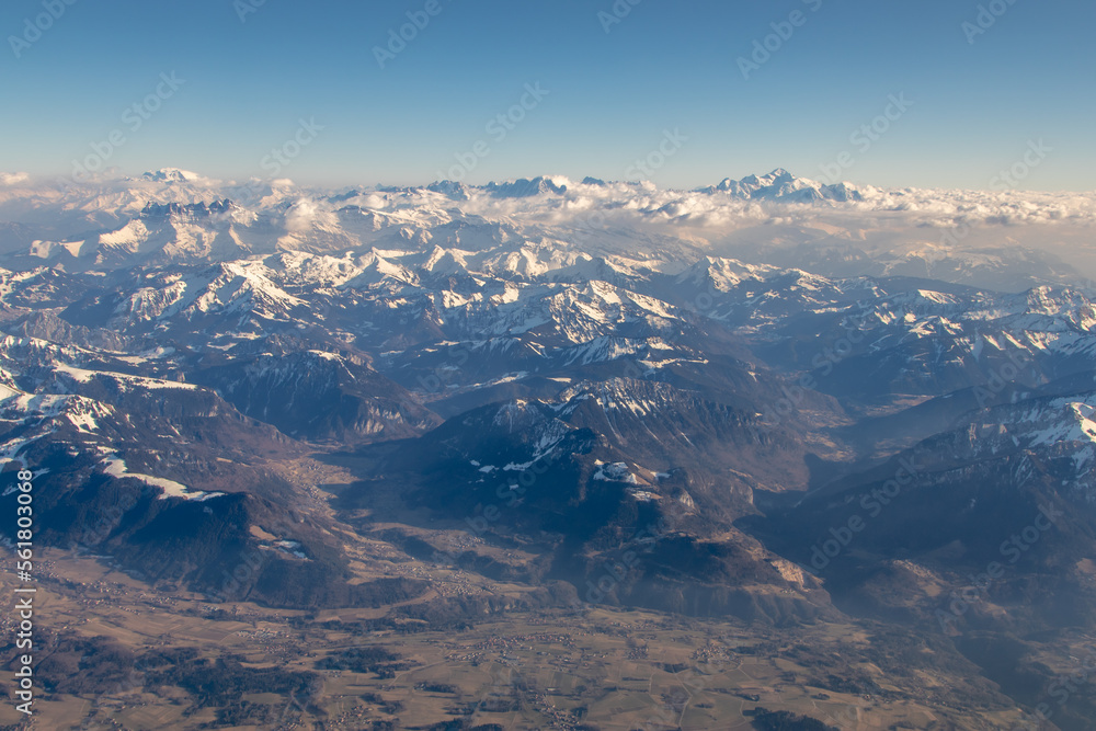 Aerial view of morning sunlight on Summer Alps. 