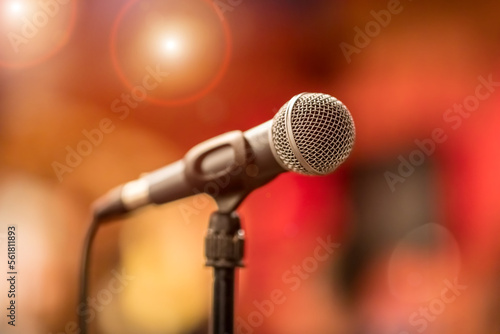 Microphone on stage against a background of auditorium.