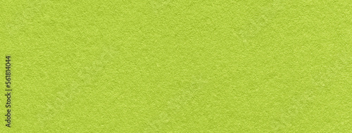 Texture of old bright green color paper background, macro. Structure of a vintage craft olive cardboard.