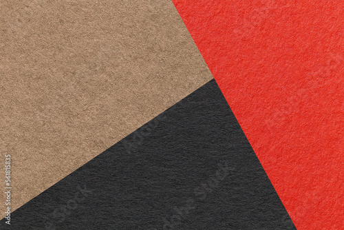 Texture of craft red, black and brown shade color paper background, macro. Structure of vintage abstract cardboard