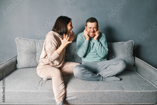 Angry woman screaming to her husband photo