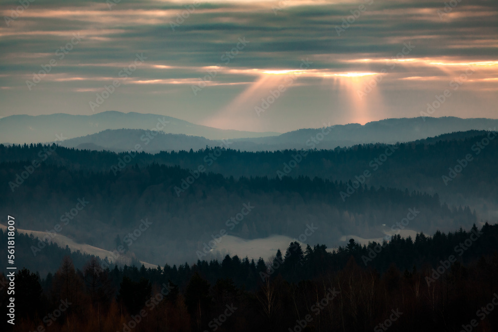 Sunrise in the mountains with sunrays from the sky, Bieszczady, Poland