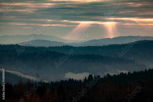 Fototapeta Naklejka Na Ścianę i Meble -  Sunrise in the mountains with sunrays from the sky, Bieszczady, Poland