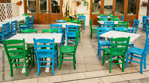 View of a restaurant with green chairs in Grado, Friuli Venezia Giulia, Italy