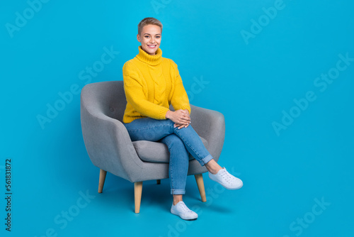 Full length photo of stunning adorable lady wear trendy clothes sitting office room take interview isolated on blue color background