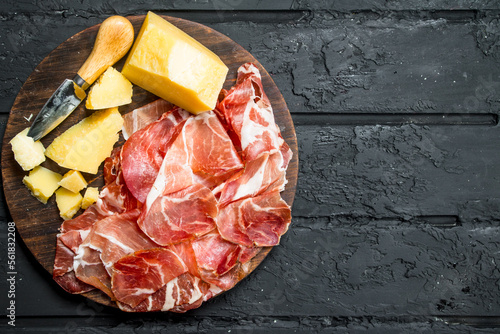 Antipasto background.Board with jamon and Parmesan.