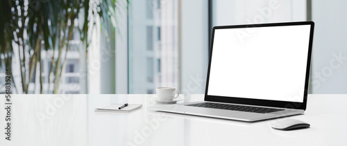 Laptop mockup with transparent screen png on table with office workspace background