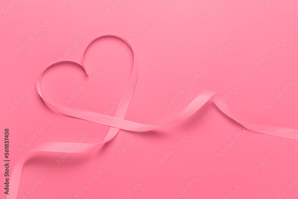Trendy Color of Year 2023 Viva Magenta. Ribbon in the shape of a heart. Valentine's day concept.
