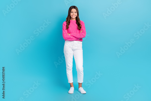 Full length photo of cute charming lady wear pink sweater arms folded smiling isolated blue color background