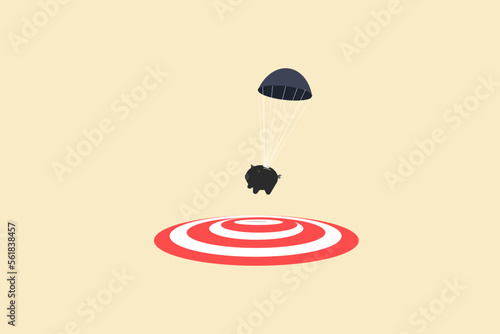 piggy bank with parachute landing on the target. concept of goal, opportunity and success.