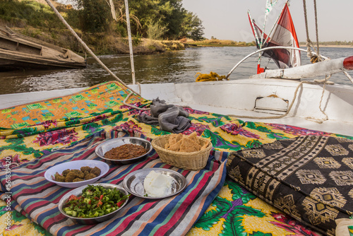 Cuadro en lienzo Traditional meal at a felucca sail boat at the river Nile, Egypt