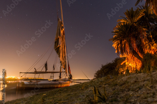 Night view of a felucca sail boat at the river Nile, Egypt