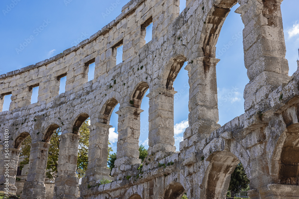 Looking up at walls of the amphitheater in Pula seen from the backstage in the amphitheater