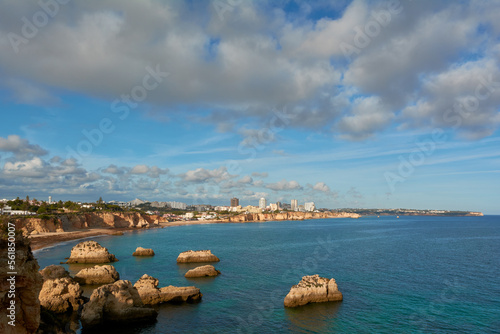 Beautiful view of the sweeping coastline from Alvor to Portimao in Algarve, Portugal photo
