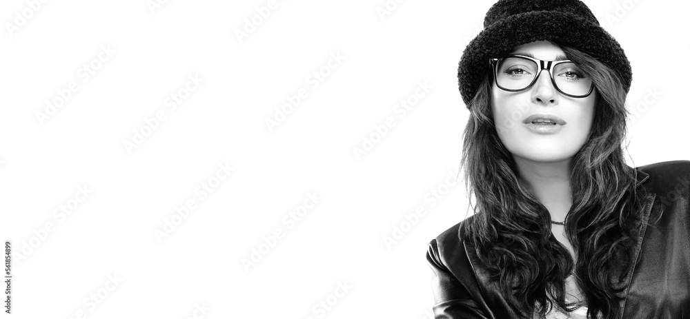Stylish sensual woman in black outfit with hat and eyeglasses. Monochrome banner portrait over white with copy space
