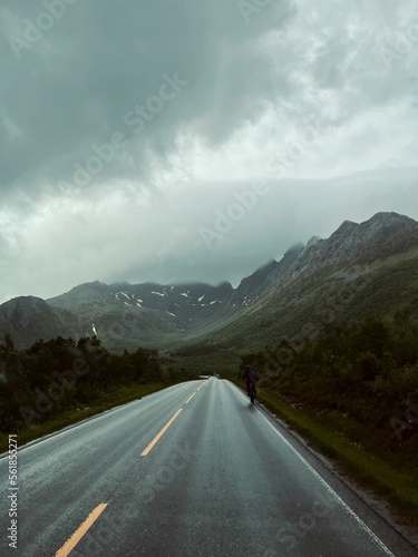 Empty highway in mountains, stormy weather, dark clouds © Oksana