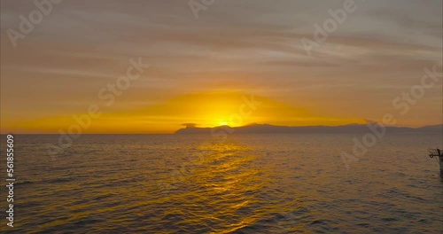 Barco Llaút mallorquín con amanecer y sol de fondo (DRONE MAVIC 3 CINE) photo
