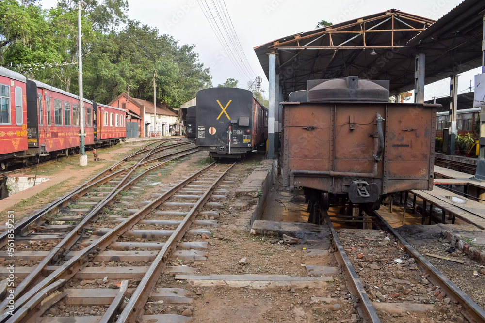 View of Toy train Railway Tracks from the middle during daytime near Kalka railway station in India, Toy train track view, Indian Railway junction, Heavy industry