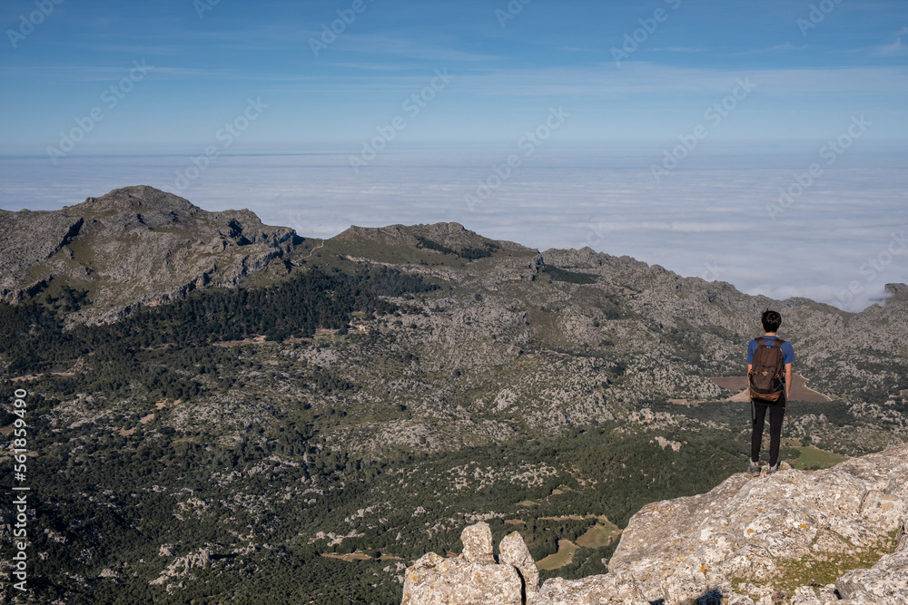 a lone hiker looking up a mountain, Escorca, Mallorca, Balearic Islands, Spain