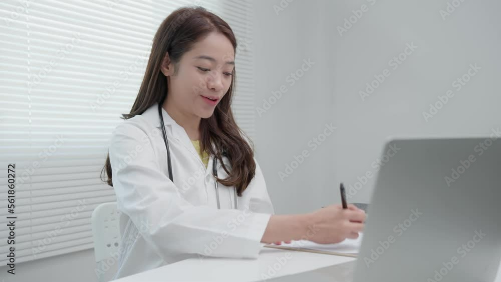tele-medical. Doctor explains the medication to the patient by video conference. Asian doctor is treating patients through telecommunication while describing the disease . Technology for health. tele-medical. Doctor explains the medication to the patient by video conference. Asian doctor is treating patients through telecommunication while describing the disease . Technology for health.