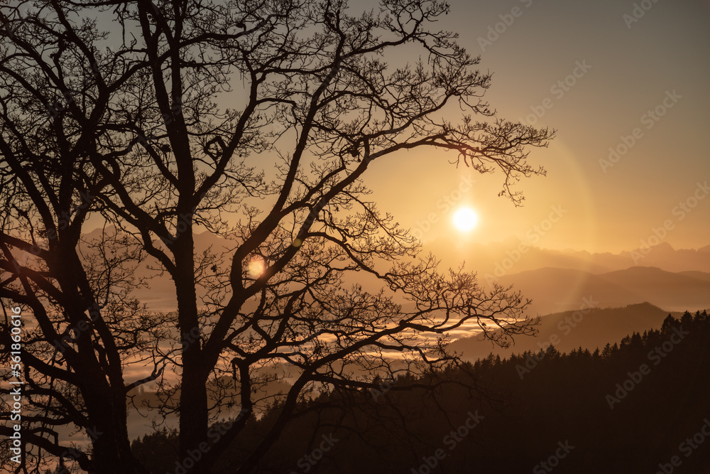 autumn sunset seen from Lorenziberg looking southwest over the foggy valleys of carinthia. autumn sunset seen from Lorenziberg looking southwest over the foggy valleys of carinthia.