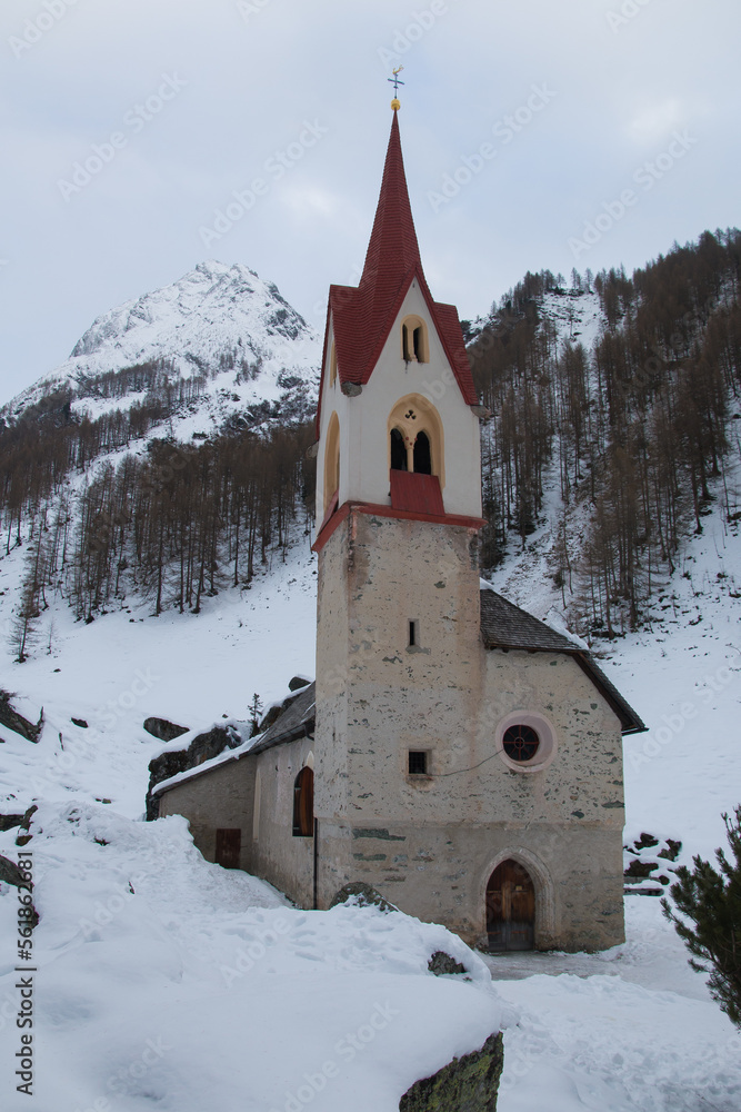 View of little chapel of Santo Spirito in Valle Aurina during winter season, Alto Adige, Italy