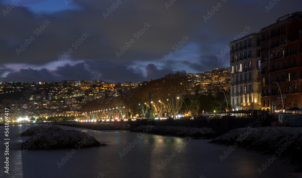 Panorama of the waterfront of Naples, Italy, at night.