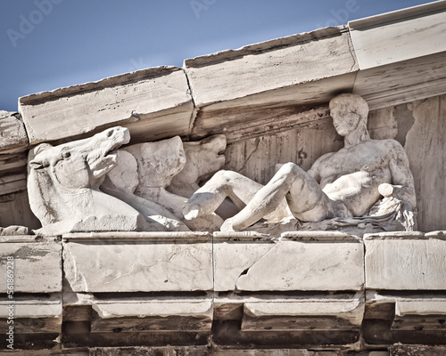 Detail of Parthenon pediment with the horses of the Sun God. The famous ancient Greek temple is situated on the acropolis of Athens. Cultural travel in Greece. photo