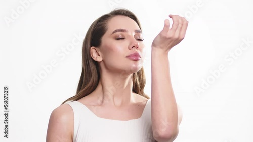 Wallpaper Mural Young woman spraying micellar water on face. Beauty woman using moisturizer bottle for spraying face. Female skincare. Girl face skin cleaning procedure at morning Torontodigital.ca