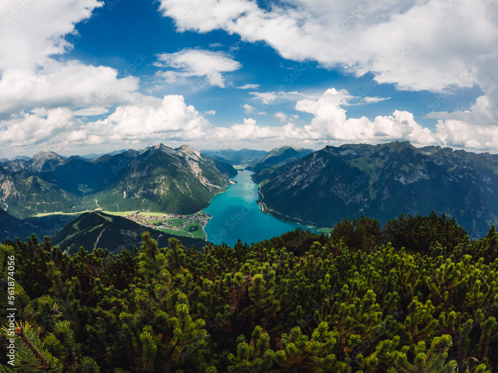 Fototapeta premium Austrian glacier water sea mountains lake landscape nature drone shot clouds sky green village alaska norway fjord blue forest 