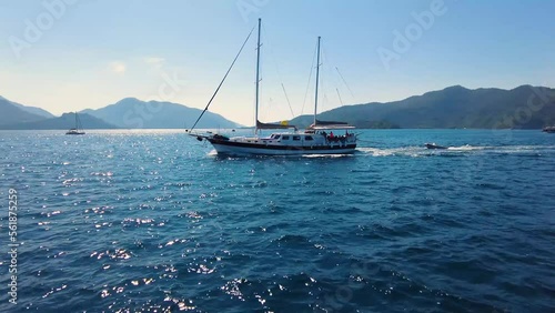 Beautiful seashore. Islands in the distance. Colorful blue sea. The beauty of Turkey. Beautiful rocks and mountains. Sunny clear day. Beautiful water.	
