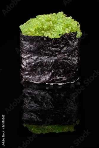 Gunkan Maki Sushi with green flying fish roe on black background