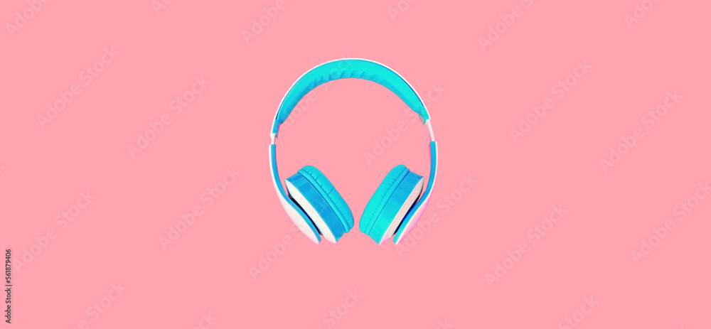 Close up of headphones on colorful pink background, top view