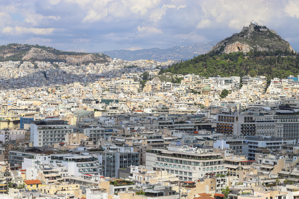 Panorama of Greek capital Athens from Athenian Acropolis. Cityscape, rooftops and mountains. Greece, Southern Europe, travel destination, vacation., metropolis.