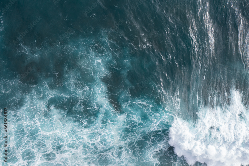 Waves breaking in the Atlantic Ocean off the coast of Madeira. A great spot for surfing in the turquoise blue water.