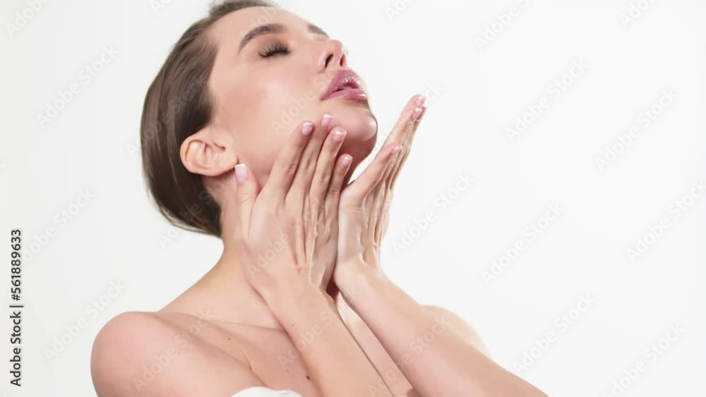 Close-up of a woman picking up cream, moisturizing lotion from a jar, applying moisturizer on her hands. Close-up of a woman picking up cream, moisturizing lotion from a jar, applying moisturizer on her hands.
