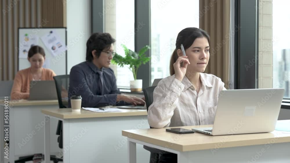 Beautiful Asian businesswoman working in the office.